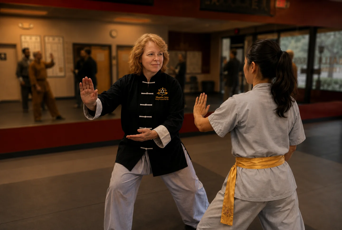An instructor guiding a student in partner practice