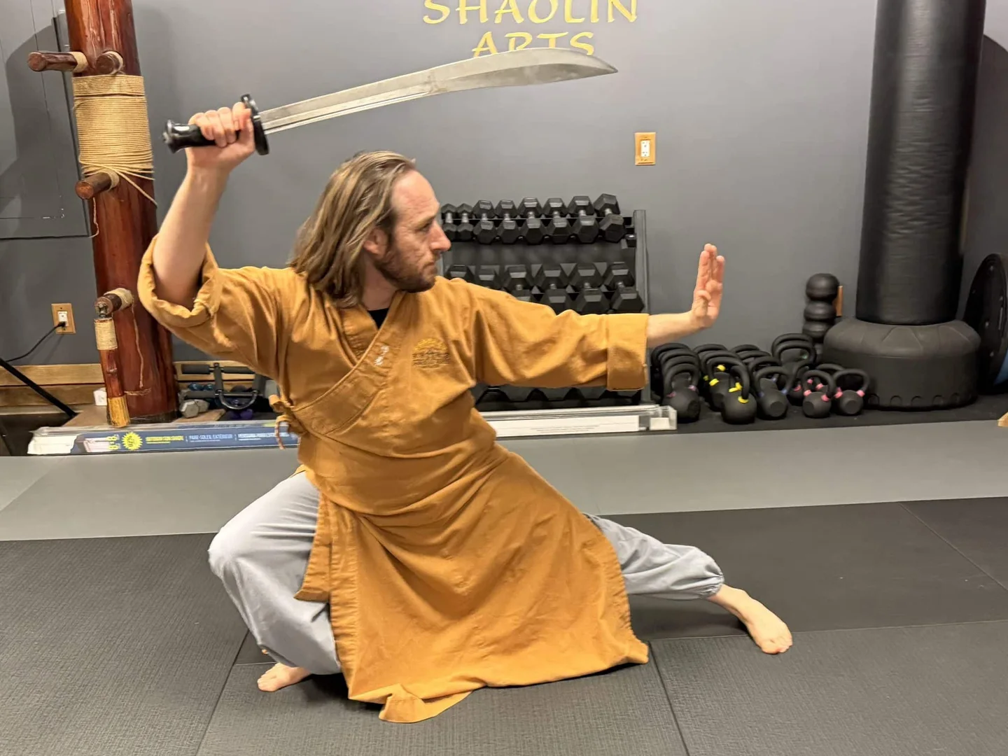 A Shaolin Arts practitioner demonstrating a broadsword form