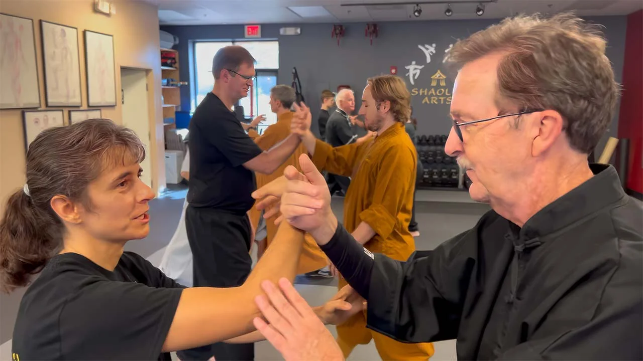 Shaolin Arts students practicing push hands with partners