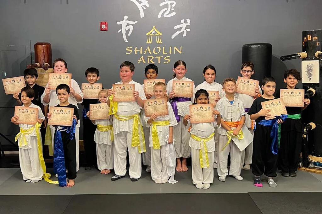Kids Martial Arts students at a sash graduation