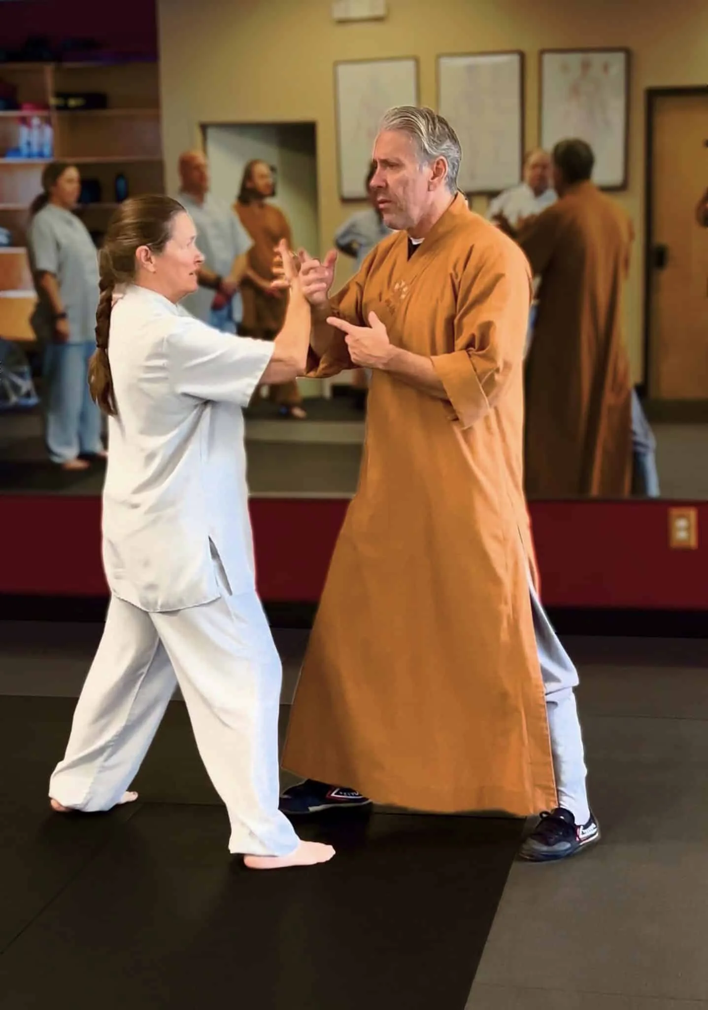 Chris Workman guiding a student through Tai Chi partner practice